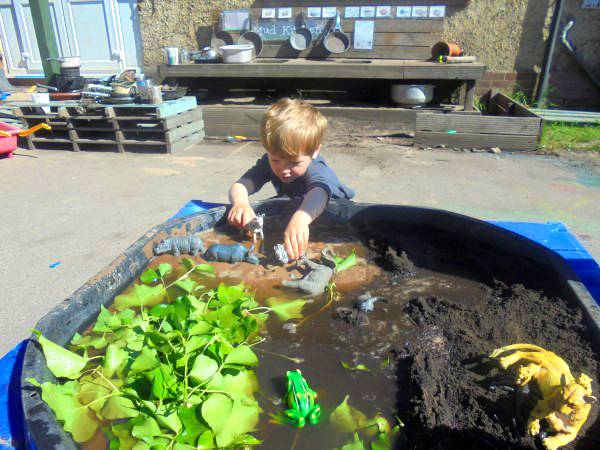 Child engaged in learning at nursery