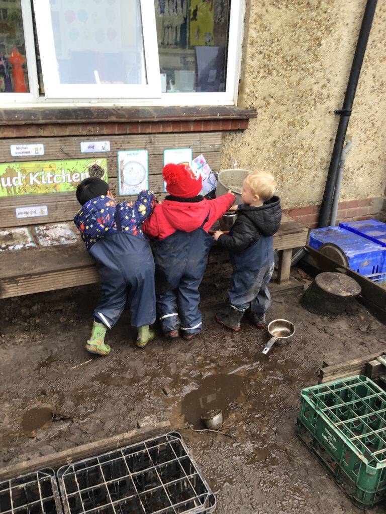 Children playing outdoors at Clever Cloggs Nursery